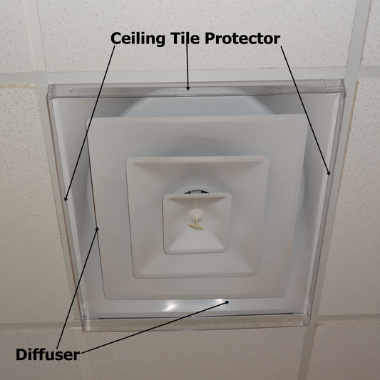 Airtech Inserts Plastic Ceiling Tile Protector in place on ceiling vent in a commercial setting with black labels identifying the Protector and Diffuser